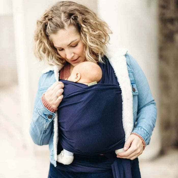 A Boba Classic Baby Wrap, made from a soft 95% French Terry cotton blend and 5% Spandex. Ergonomic, award-winning design fits babies from 7 Ibs to 35 Ibs, best up to 20 Ibs. Machine washable, dryer friendly, and certified hip-healthy. Navy Blue