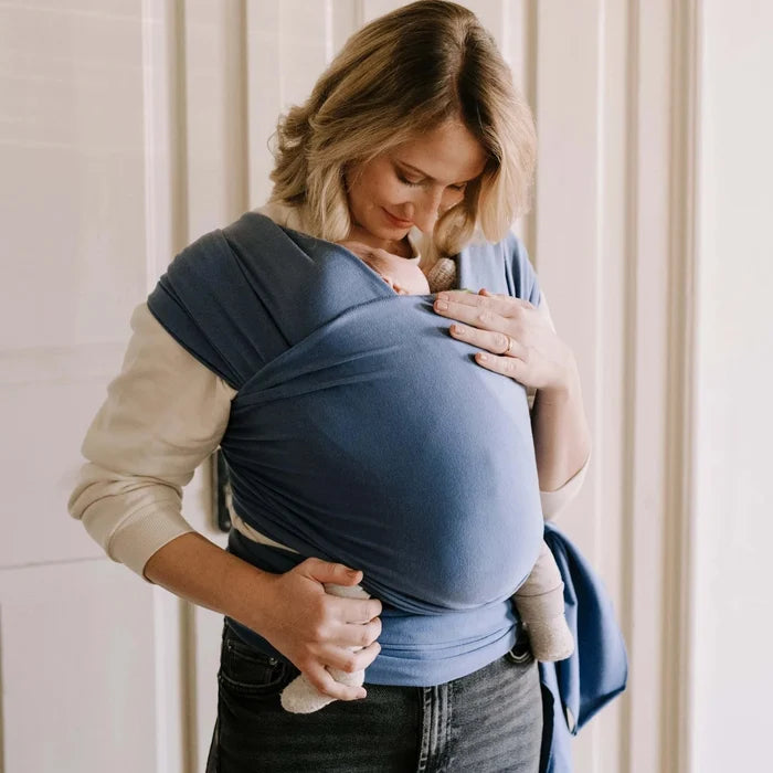 A Boba Classic Baby Wrap, made from a soft 95% French Terry cotton blend and 5% Spandex. Ergonomic, award-winning design fits babies from 7 Ibs to 35 Ibs, best up to 20 Ibs. Machine washable, dryer friendly, and certified hip-healthy. Vintage Navy