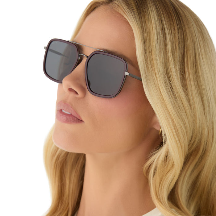 on model - female wearing diff eyewear featuring the jordan navigator sunglasses with a dark cherry lacquer frame and grey gradient polarized lenses angled view