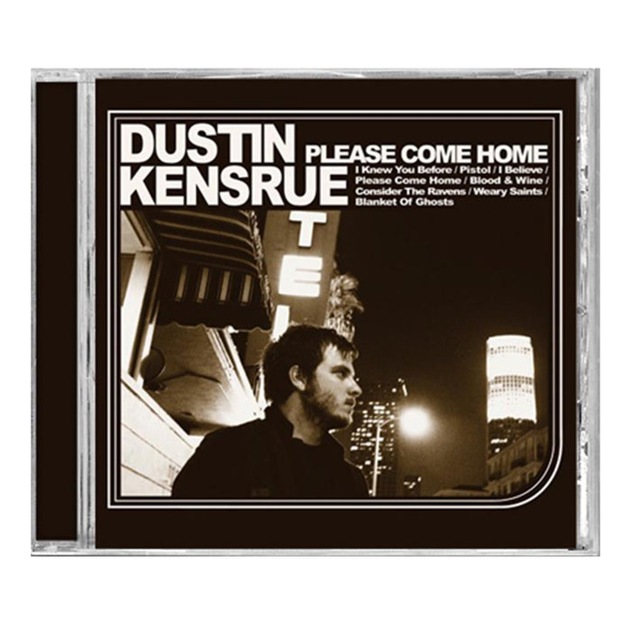 CD cover for Please Come Home by Dustin Kensrue, displaying a black-and-white city night photo of Kensrue glancing sideways with neon hotel sign and skyscraper in the background. Classic folk-country vibe; tracklist displayed above. Brand: Dustin Kensrue.