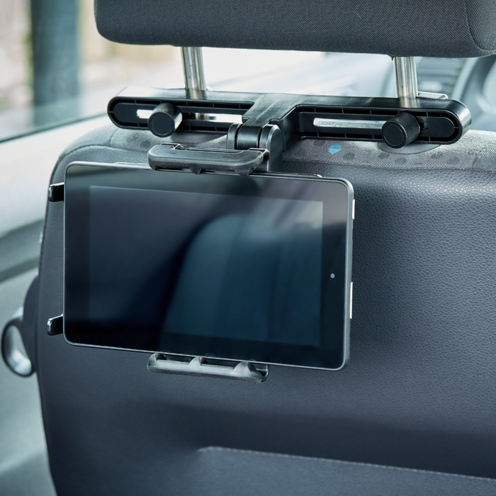 ipad black mounted on headrest of vehicle