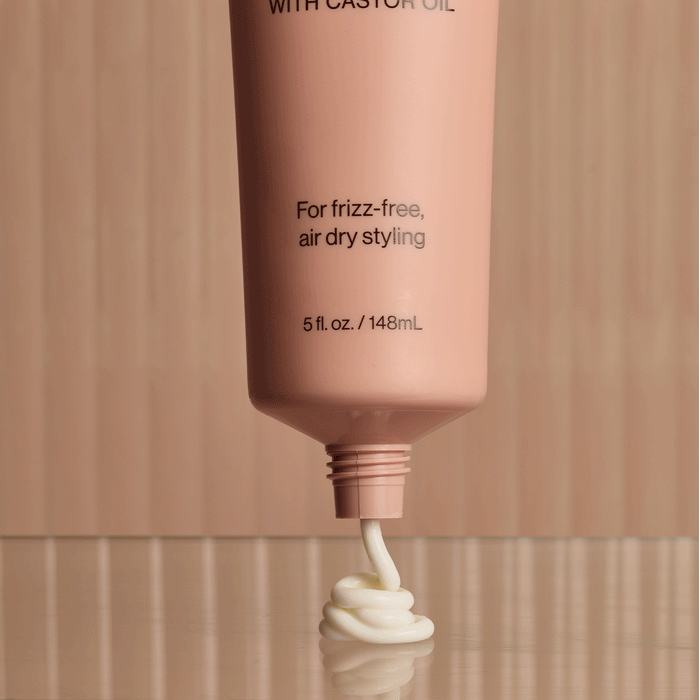 KITSCH Smoothing Air Dry Cream β animated product shot showing bottle from multiple angles β Infused with Castor Oil, Squalane, Panthenol & Coconut Oil to nourish, hydrate, and protect β sheer, non-greasy formula won't weigh hair down