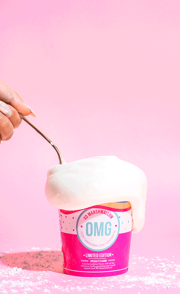 A gif of a spoon scooping and stretching XO Marshmallow's vegan vanilla marshmallow fluff out of the pint. This shows how stretchy it is and how it can be eaten with a spoon like ice cream or as a dip for fruit or graham crackers.