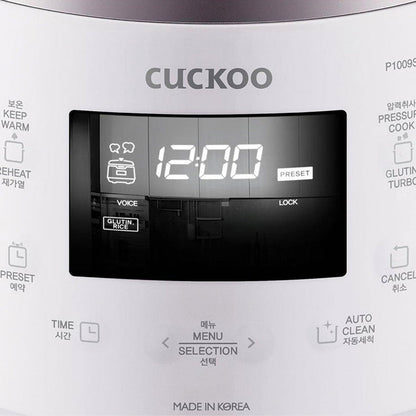 Close-up of a CUCKOO rice cooker control panel with digital display, labeled function buttons, and menu selection interface. (CRP-P1009S)