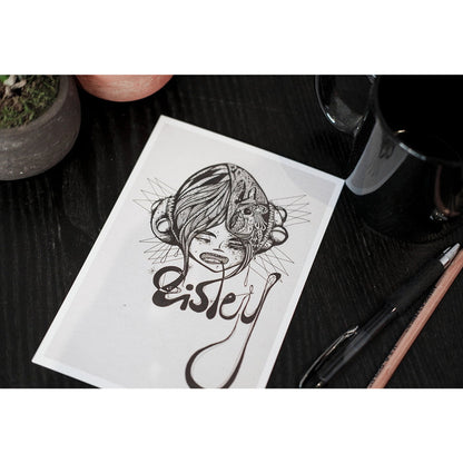 A photo of the "Eisley" Print on a table next to a coffee mug, next to the print are a pen and pencil.