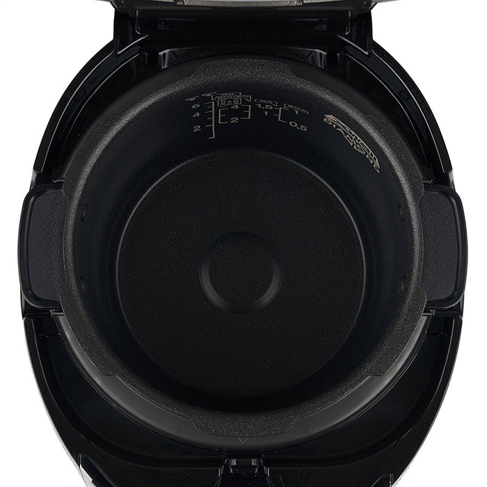 Top-down view inside a CUCKOO rice cooker, showing non-stick inner pot with water level markings and Diamond coating. (CRP-P0609S)