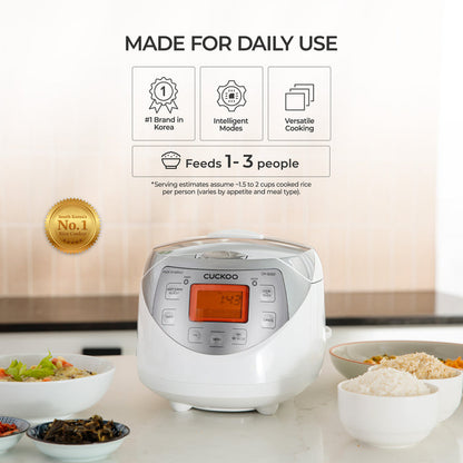 A Cuckoo rice cooker is shown on a kitchen counter with bowls of rice and vegetables, under the text 'MADE FOR DAILY USE' and feature icons. The product is white with a silver front panel and an orange digital display.