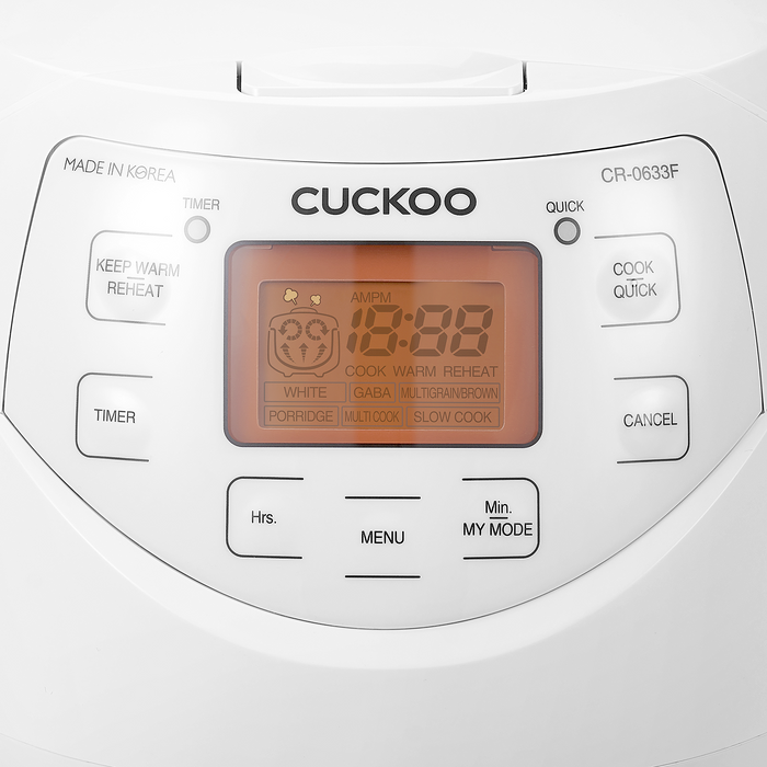 Close-up of a Cuckoo rice cooker control panel featuring an orange digital display, function buttons, and model number. (CR-0633F)