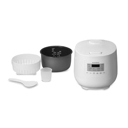 White Cuckoo rice cooker with included accessories: inner pot, steaming basket, measuring cup, and rice paddle. (CR-0641F)
