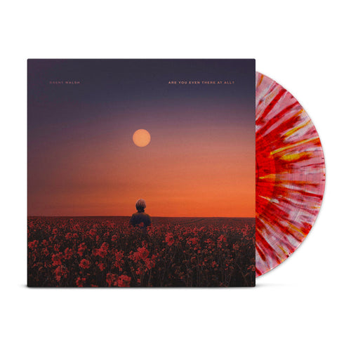 Brent Walsh’s limited pressing vinyl, “Are You Even There At All,” features a red and white splatter design and cover art of a person in a red flower field at sunset under a purple-orange sky.