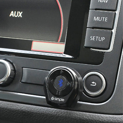 Bluetooth car adapter mounted on a vehicle dashboard console