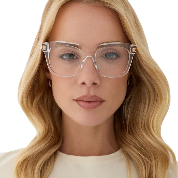 on model - female wearing diff eyewear featuring the bella xs square prescription glasses with a clear crystal with gold frame front view