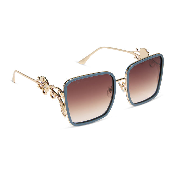 disney princess x diff eyewear featuring the belle 2.0 oversized square sunglasses with a gold and enchanting blue frame with brown gradient polarized lenses angled view
