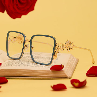lifestyle - disney princess x diff eyewear featuring the belle 2.0 prescription glasses with a gold and blue frame laying on a book