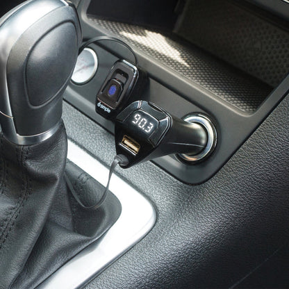Bluetooth FM transmitter plugged into a car cigarette lighter port