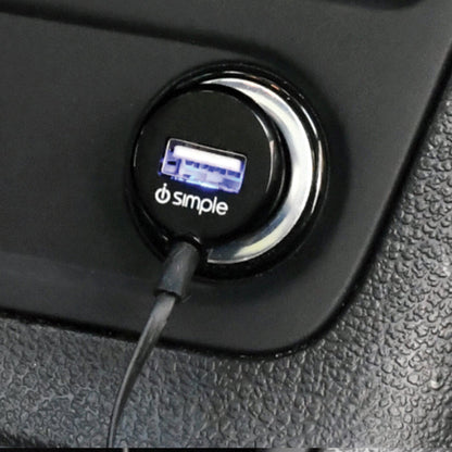 Simple brand USB car charger plugged into a vehicle power outlet
