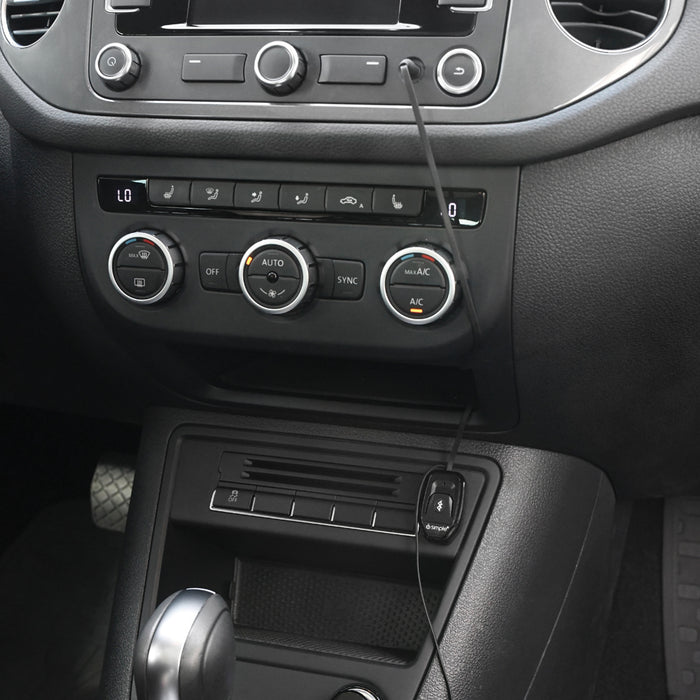 Bluetooth adapter plugged into car dashboard console