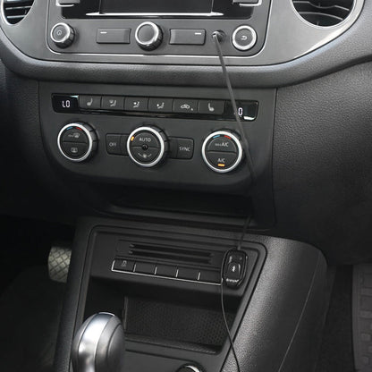Bluetooth adapter plugged into car dashboard console