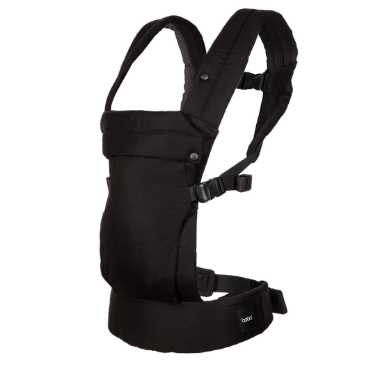 A Boba Auri black baby carrier shown from the side against a solid white background, featuring padded shoulder straps, a front pouch, and a waist belt with a small visible 'boba' brand tag.