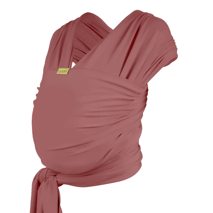 A Boba Classic Baby Wrap, made from a soft 95% French Terry cotton blend and 5% Spandex. Ergonomic, award-winning design fits babies from 7 Ibs to 35 Ibs, best up to 20 Ibs. Machine washable, dryer friendly, and certified hip-healthy. Dusty Pink
