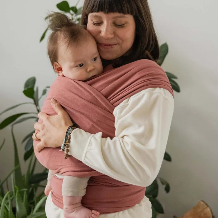 A Boba Classic Baby Wrap, made from a soft 95% French Terry cotton blend and 5% Spandex. Ergonomic, award-winning design fits babies from 7 Ibs to 35 Ibs, best up to 20 Ibs. Machine washable, dryer friendly, and certified hip-healthy. Dusty Pink