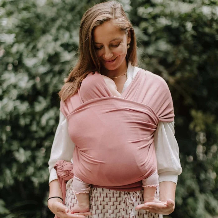 A Boba Classic Baby Wrap, made from a soft 95% French Terry cotton blend and 5% Spandex. Ergonomic, award-winning design fits babies from 7 Ibs to 35 Ibs, best up to 20 Ibs. Machine washable, dryer friendly, and certified hip-healthy. Dusty Pink