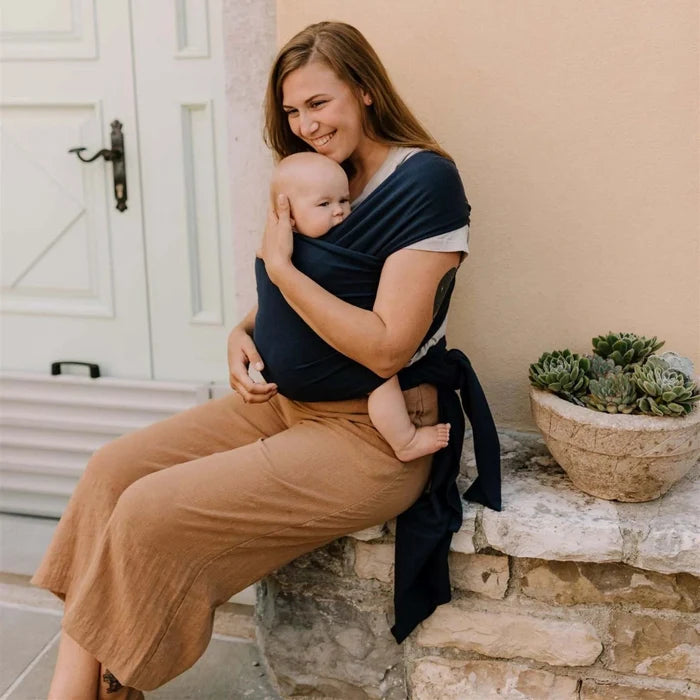 A Boba Classic Baby Wrap, made from a soft 95% French Terry cotton blend and 5% Spandex. Ergonomic, award-winning design fits babies from 7 Ibs to 35 Ibs, best up to 20 Ibs. Machine washable, dryer friendly, and certified hip-healthy. Navy Blue