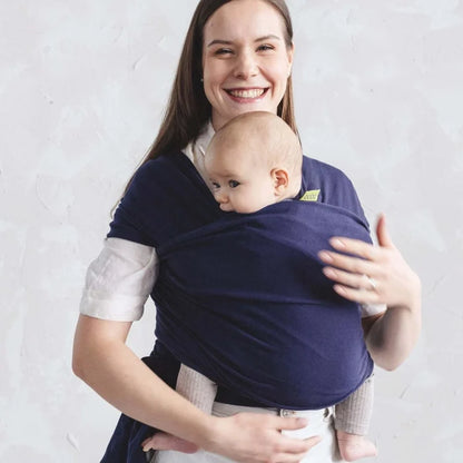 A Boba Classic Baby Wrap, made from a soft 95% French Terry cotton blend and 5% Spandex. Ergonomic, award-winning design fits babies from 7 Ibs to 35 Ibs, best up to 20 Ibs. Machine washable, dryer friendly, and certified hip-healthy. Navy Blue