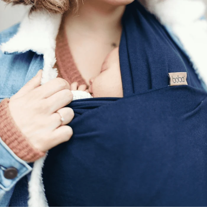 A Boba Classic Baby Wrap, made from a soft 95% French Terry cotton blend and 5% Spandex. Ergonomic, award-winning design fits babies from 7 Ibs to 35 Ibs, best up to 20 Ibs. Machine washable, dryer friendly, and certified hip-healthy. Navy Blue