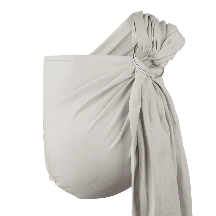 A Boba Ring Sling Baby Carrier made from a unique linen bamboo viscose fabric blend, perfect for all seasons. Lightweight and breathable, it stores compactly, ideal for newborn snuggles to toddler ups and downs (8 - 35Ibs). Pampas Beige