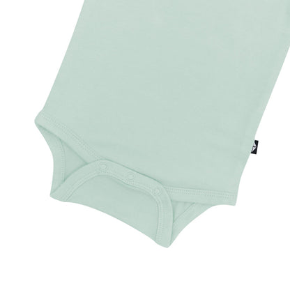 Close up of the snaps on the Kyte Baby Bodysuit in Sage