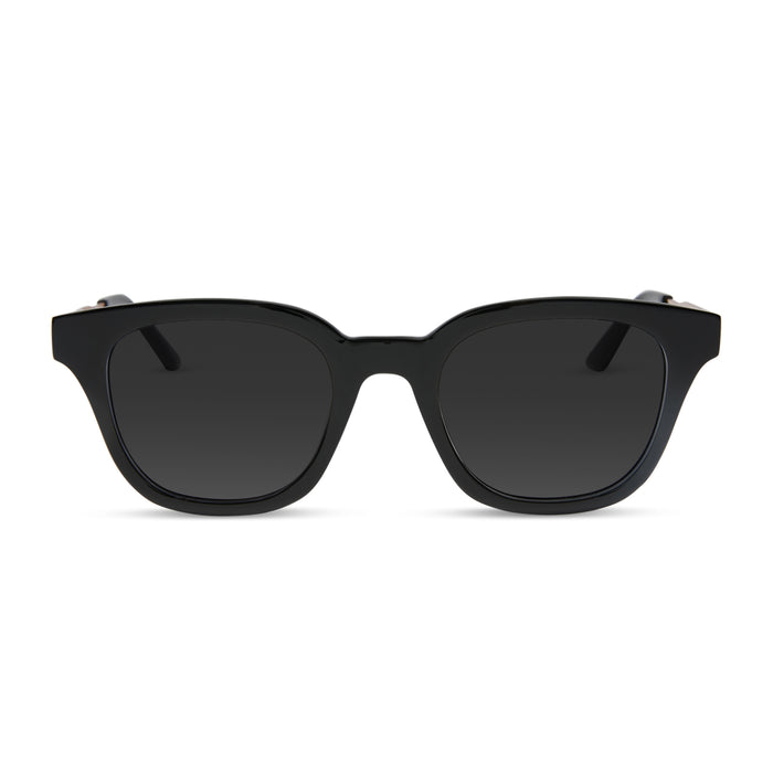 diff eyewear featuring the bridget round prescription sunglasses with a black with gold frame and prescription lenses front view