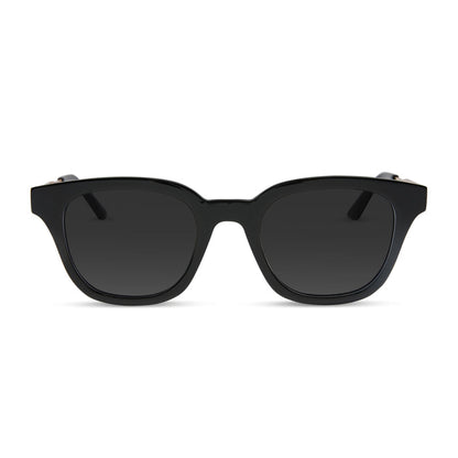 diff eyewear featuring the bridget round prescription sunglasses with a black with gold frame and prescription lenses front view