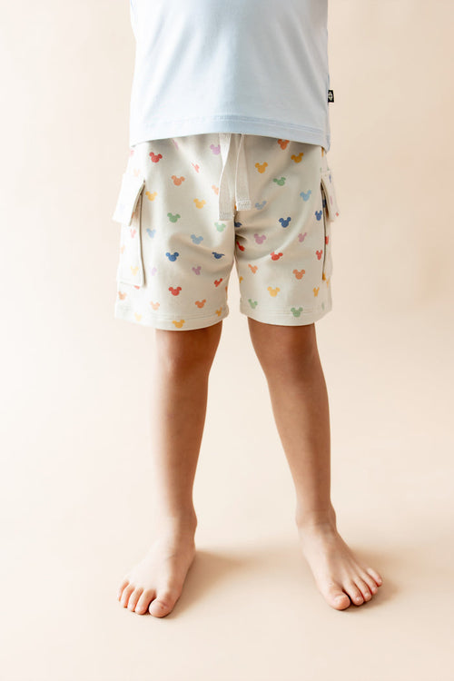 Close up on cargo shorts with pastel mickey mouse head print