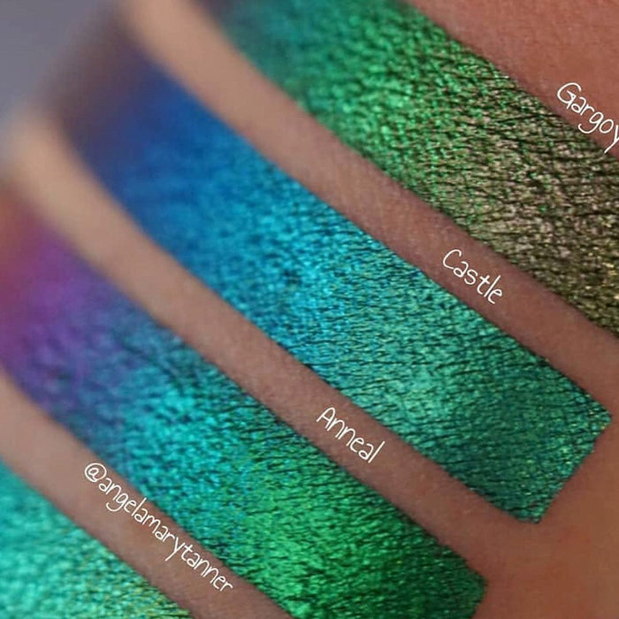 Close up arm swatches on medium skin tone of Castle Jewelled Multichrome Eyeshadow shifts compared to Gargoyle, Anneal