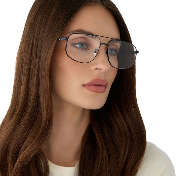 on model - female wearing diff eyewear featuring the charley navigator glasses with a shiny black frame angled view