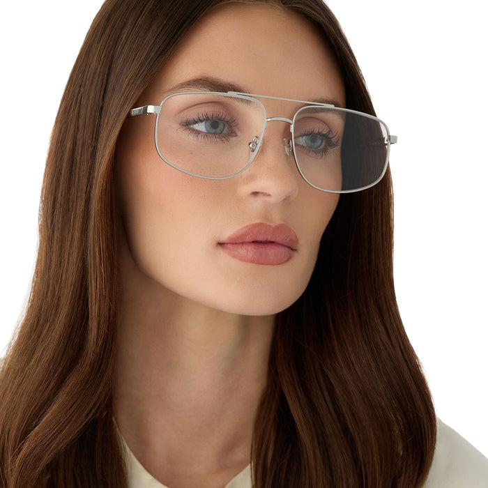 on model - female wearing diff eyewear featuring the charley navigator prescription glasses with a silver frame angled view