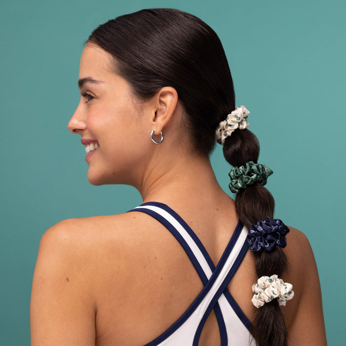 KITSCH Ruched Satin Scrunchies 5pc Set – Cream, Court Green & Navy Blue — model styling hair with a ruched satin scrunchie — silky ruched satin is gentle on all hair types and won't crease or pull