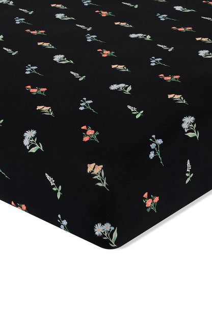 Black Crib Sheet in Wildflower print on a white background