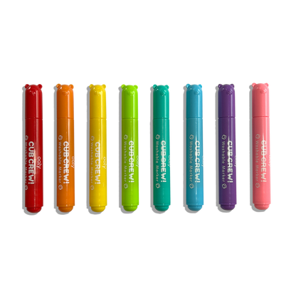 Row of all 8 capped OOLY Cub Crew Washable Markers on a white background