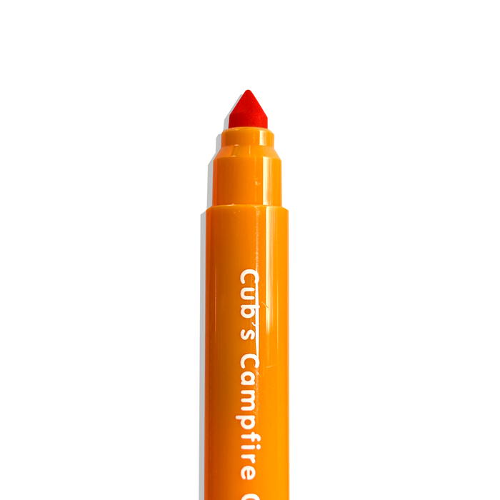 Close up of uncapped orange OOLY Cub Crew Washable Markers on a white background