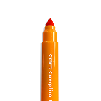 Close up of uncapped orange OOLY Cub Crew Washable Markers on a white background