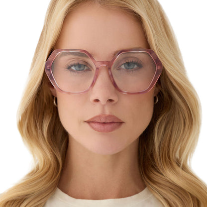 on model - female wearing diff eyewear featuring the dixie hexagon prescription glasses with a fleur pink tortoise frame front view