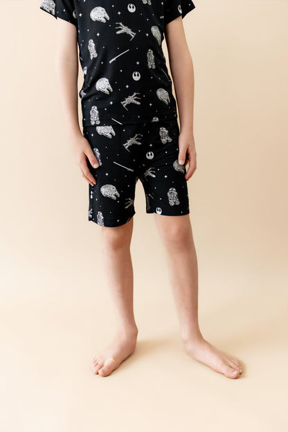 Close up of young boy wearing the Drawstring Short in STAR WARS™ with a matching shirt