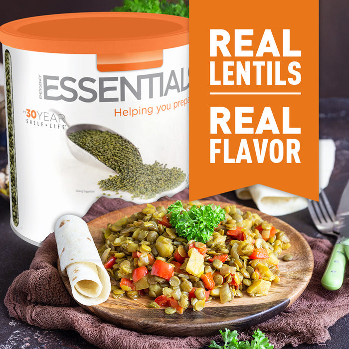 Container of lentils with a dish of lentil salad on a wooden plate