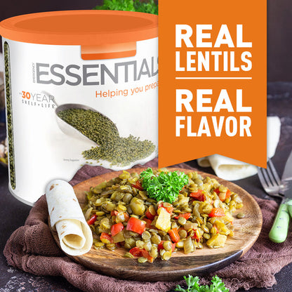Container of lentils with a dish of lentil salad on a wooden plate