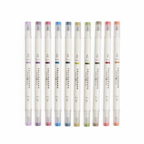 Set of Calligraphic markers with colored caps on a white background