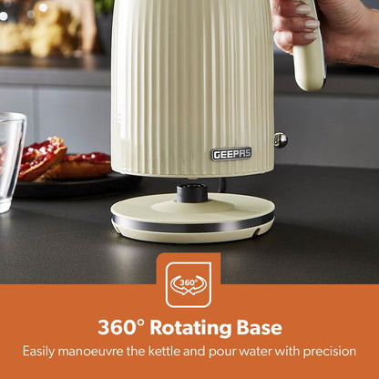 Cream 1.7L electric kettle with fluted design and chrome accents. 360-degree rotating base.