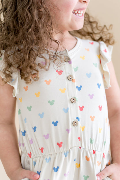 Close up on buttons on the front of the flutter sleeve romper with mickey head pattern