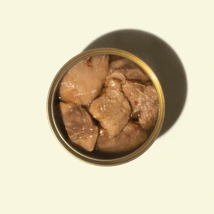 Can of fish meat on a beige background